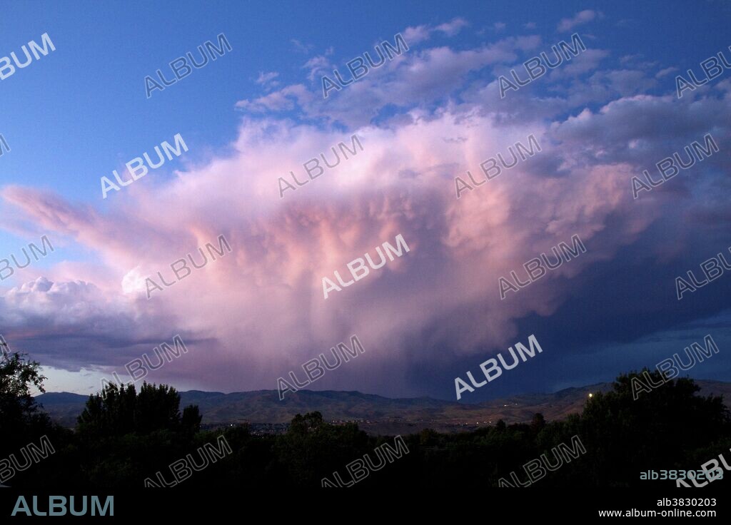 Summer storm cloud at sunset over the foothills near Boise, Idaho.
