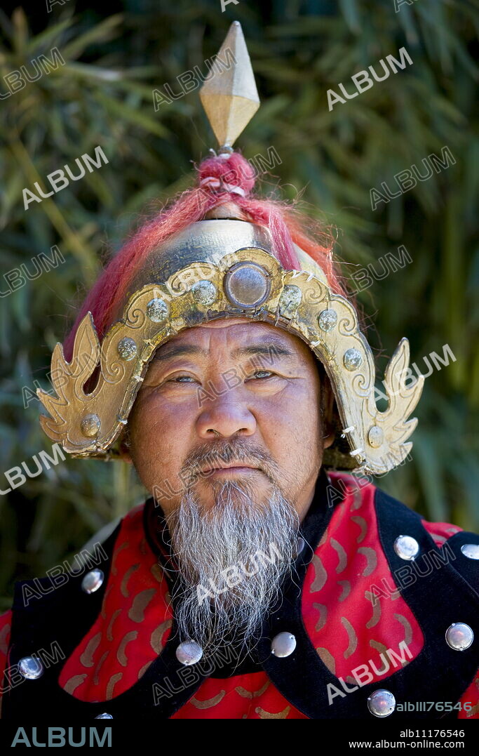 Man dressed in Mongolian Warrior costume at The Great Wall of China, Mutianyu, north of Beijing.
