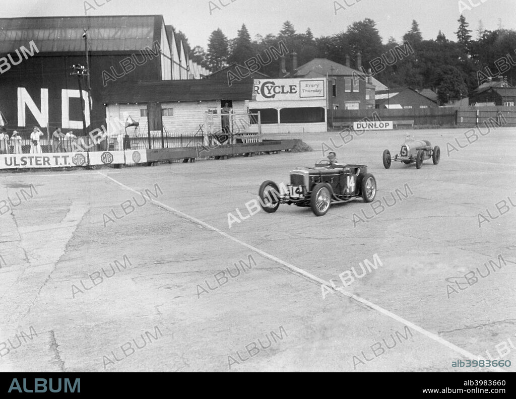 Centre: Frazer-Nash Stripped sports 1496S cc.  Entry No: 14. Driver: Grogan, Cdr. R.T. R.N. Right of centre: Bugatti  Type 37 Stripped sports.  1496S cc. Entry No: 5. Driver: Lemon Burton, J. Brooklands.  B.A.R.C. Date: 7.8.33.