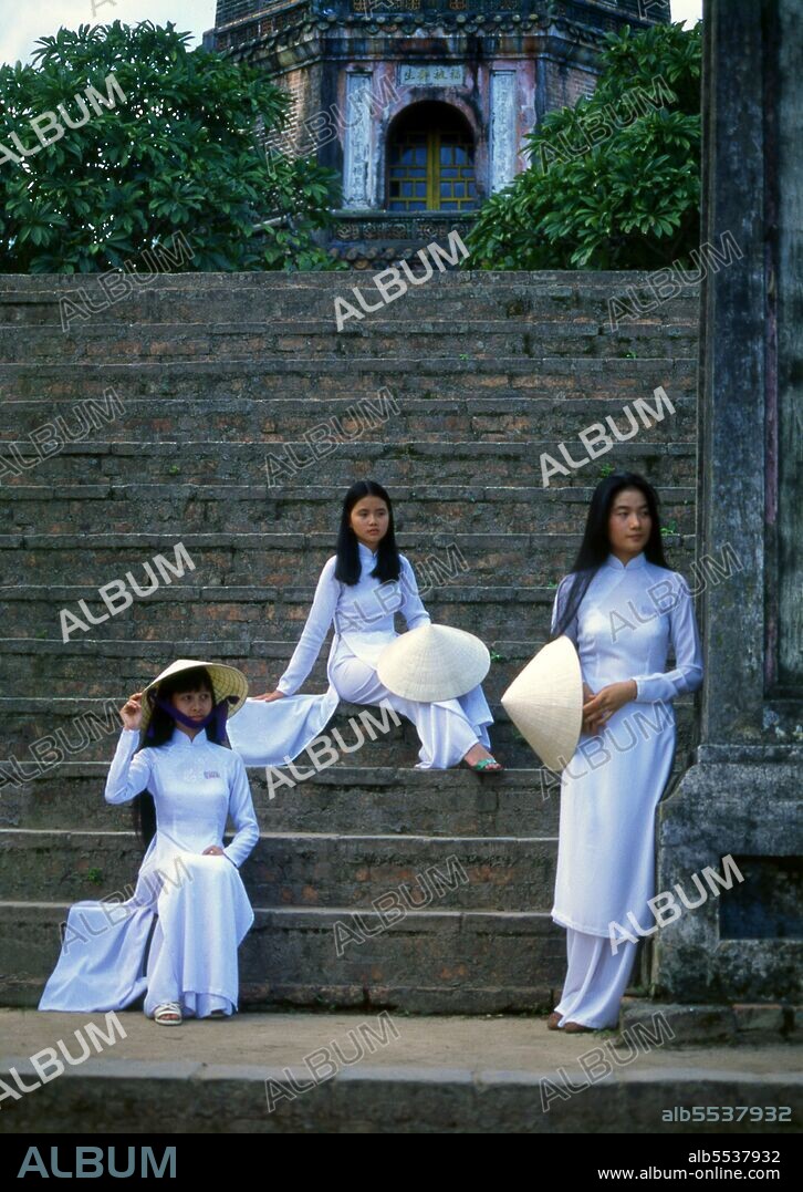 The ao dai (Vietnamese: áo dài) is a Vietnamese national costume, now most commonly for women. In its current form, it is a tight-fitting silk tunic worn over pantaloons. The word is pronounced ow-zye in the north and ow-yai in the south, and translates as 'long dress'. The name áo dài was originally applied to the dress worn at the court of the Nguy?n Lords at Hu? in the 18th century. This outfit evolved into the áo ngu thân, a five-paneled aristocratic gown worn in the 19th and early 20th centuries. Inspired by Paris fashions, Nguy?n Cát Tu?ng and other artists associated with Hanoi University redesigned the ngu thân as a modern dress in the 1920s and 1930s.