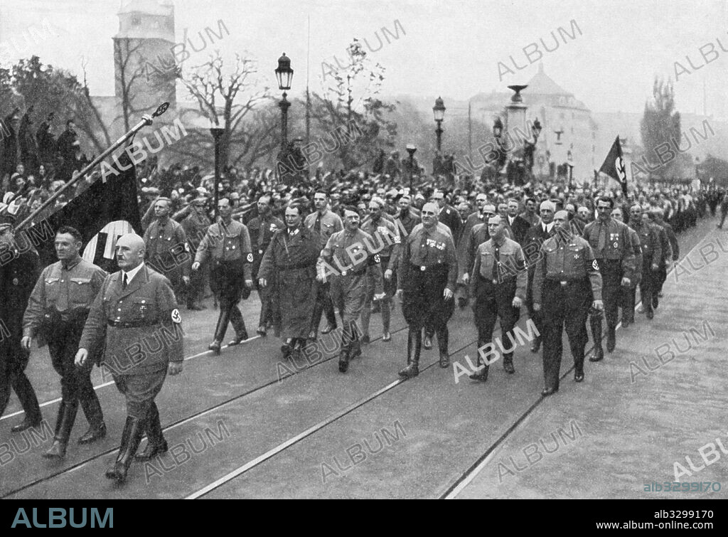 Adolf Hitler and party veterans reenact historic march - November 9, 1934.