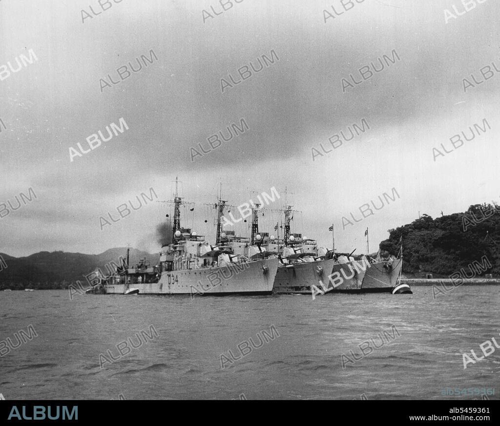 Royal Navy Destroyers Take A Breather - His Majesty's Ships COCKDE, CHARITY, CONSTORT and COSSACK take a well earned breather from Korean War duties at U.S. Fleet Activities Yokosuka. The DD's are commanded by Commander John T. Kimpton, RN; Commander John Henley, RN; Commander George B. Rowe, RN, and Capt. Varyl C. Begg, DSC, RN, respectively. Korean action of the vessels includes the invasion of Inchon, the bombardment of Wonsan, ingshore patrol off the east and wet coast and anti-submarine patrol in support of Royal Navy and United States Navy aircraft carriers. August 10, 1951. (Photo by Official U S Navy Photograph).