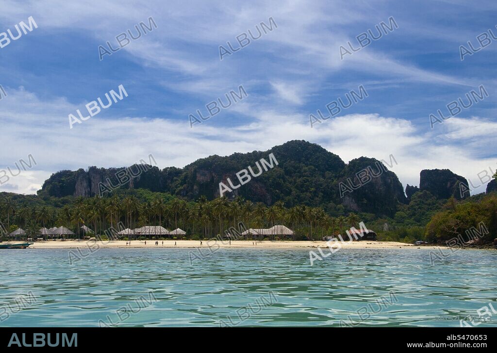 Ko Phi Phi consists of two islands, Phi Phi Leh and Phi Phi Don, located southeast of Phuket. Both are part of Hat Noppharat Thara Ko Phi Phi National Marine Park. Set in the centre of the Sea of Phuket, Ko Phi Phi is almost equidistant from Phuket and Krabi and can be reached by boat in around two hours. Phi Phi Don is the larger of the two islands, with scenic hills, steep cliffs, silken beaches, azure waters and remarkable bird- and sea-life. The island narrows at the middle where long, white-sand beaches are only a few hundred metres apart. Boats from Krabi and Phuket dock at Ao Ton Sai on the southern side of the island. Hat Yao or 'Long Beach' faces south and is famous for the good snorkelling to be had on its coral reefs. To the northeast Hat Lanti is another fine beach with good waves for surfing. North of this beach is beautiful Ao Bakao, a bay with a small resort, while near the tip of Laem Tong are three more luxury resorts.