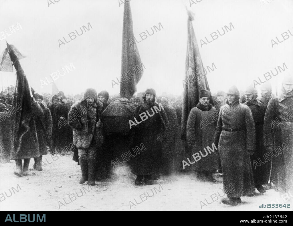 Lenin's funeral, members of the politburo (joseph stalin, left front) carrying the casket into the crypt near the kremlin wall in red square, moscow, january 1924.