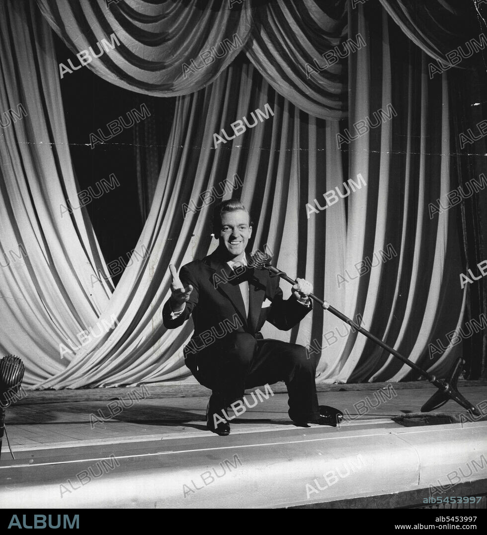 David Whitfield - "From rags to Riches". One of the experts who have followed the fantastic rise of David Whitfield describes him as "a male Vera Lynn". It is his sincerity plus the appeal of the 'nice clean looking boy' which make his popularity. November 30, 1954. (Photo by Russell).