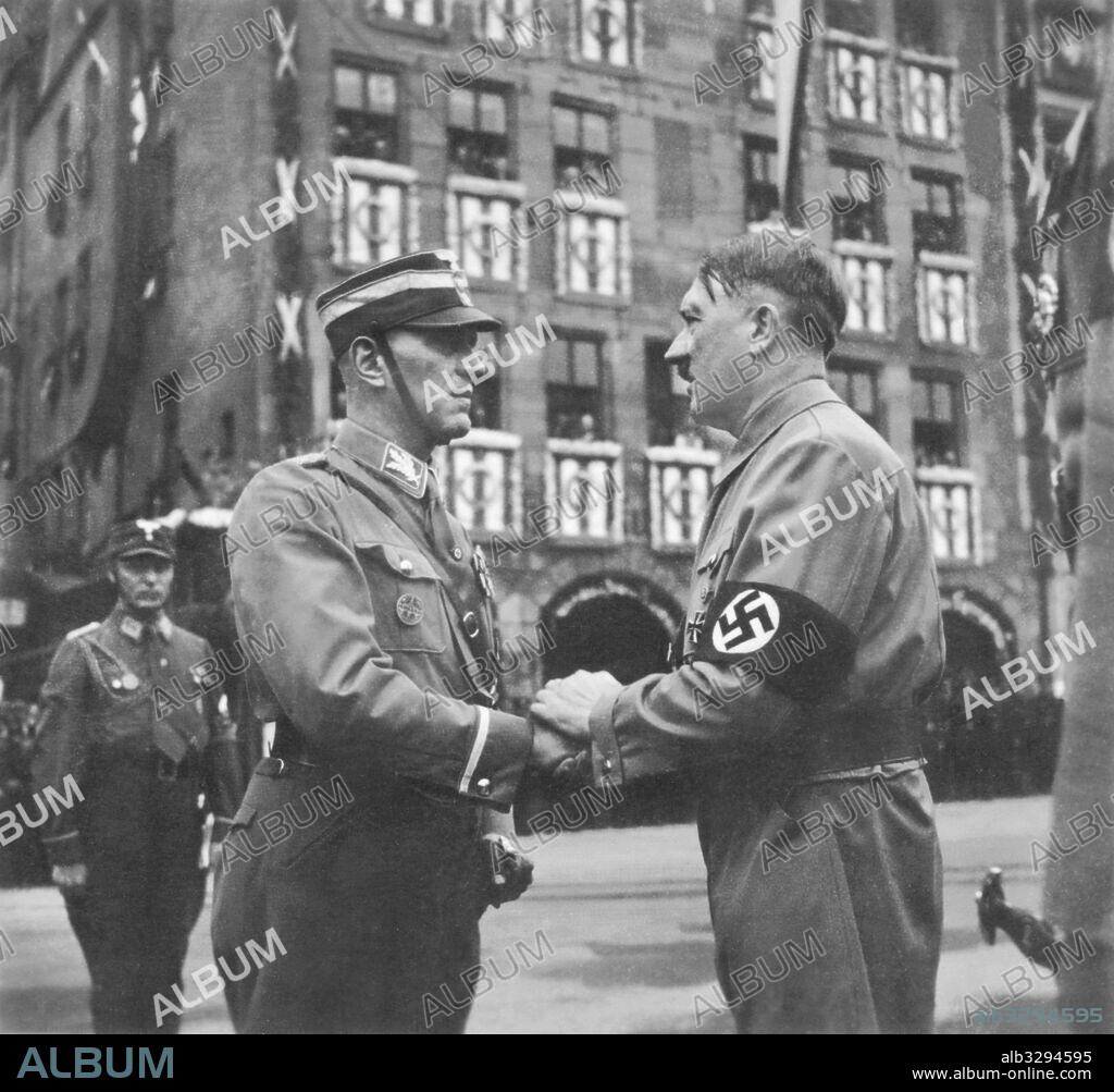 Adolf Hitler welcomes Gruppenfuhrer Juttner at the 1937 Nuremberg Rally of Work.