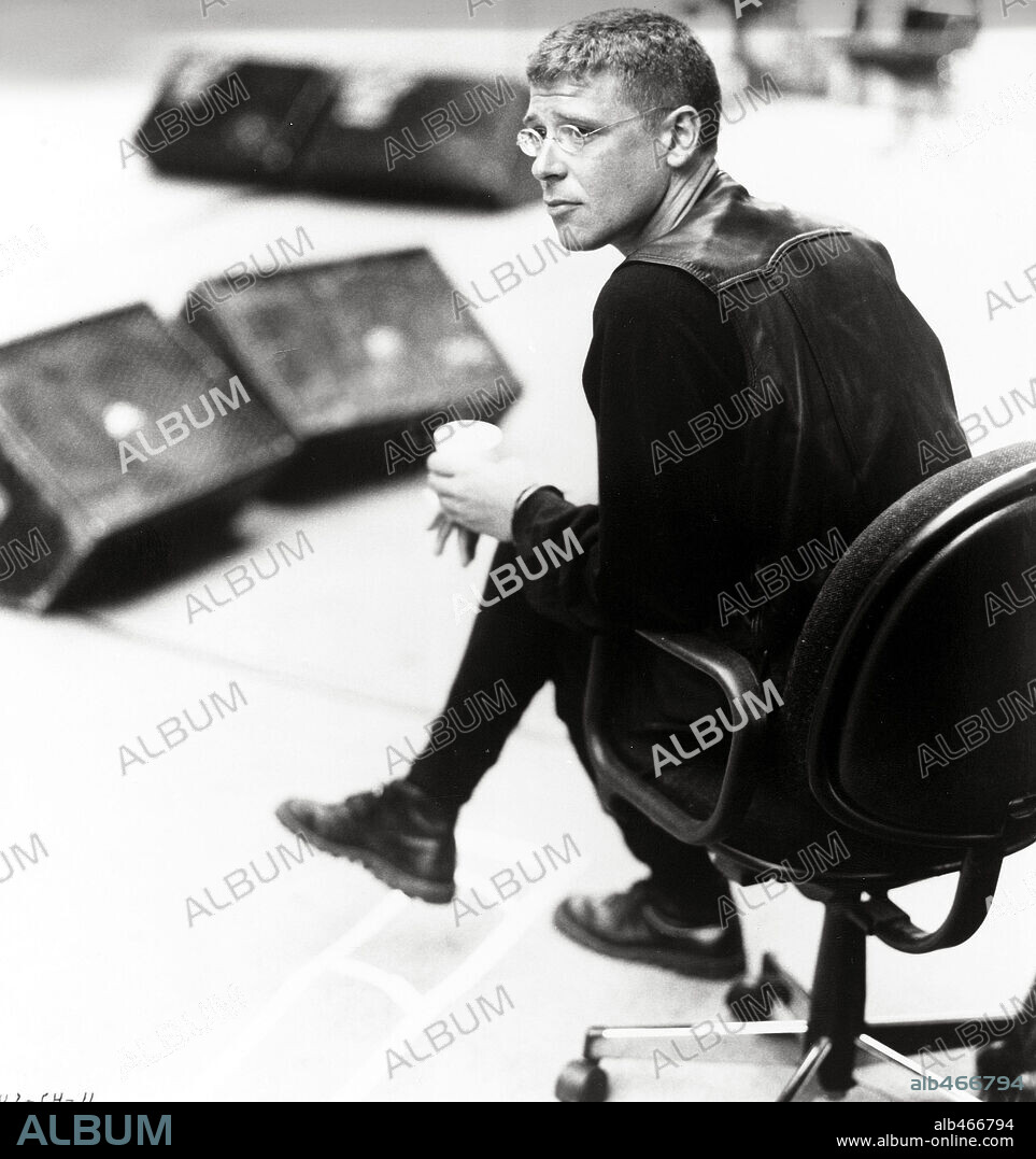 ADAM CLAYTON in U2: RATTLE AND HUM, 1988, directed by PHIL JOANOU. Copyright PARAMOUNT PICTURES.