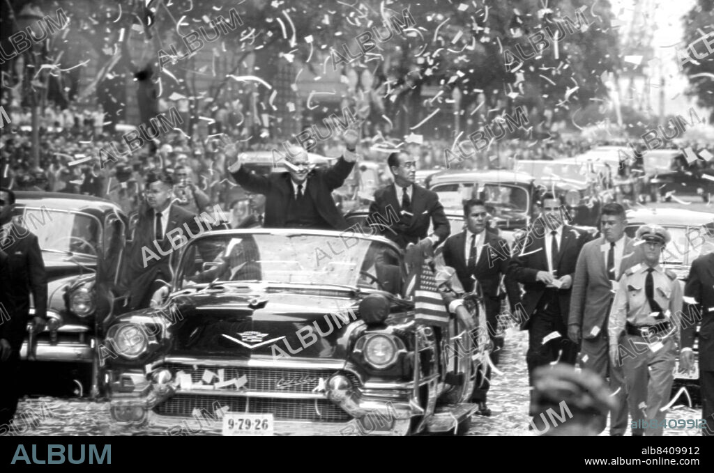 U.S. President Dwight D. Eisenhower standing in automobile beside Brazilian President Juscelino Kubitschek, waving to crowds during ticker tape parade, Avenida Rio Branco, Rio de Janeiro, Brazil, USA, Marion S. Trikosko, U.S. News & World Report Magazine Photograph Collection, February 24, 1960.