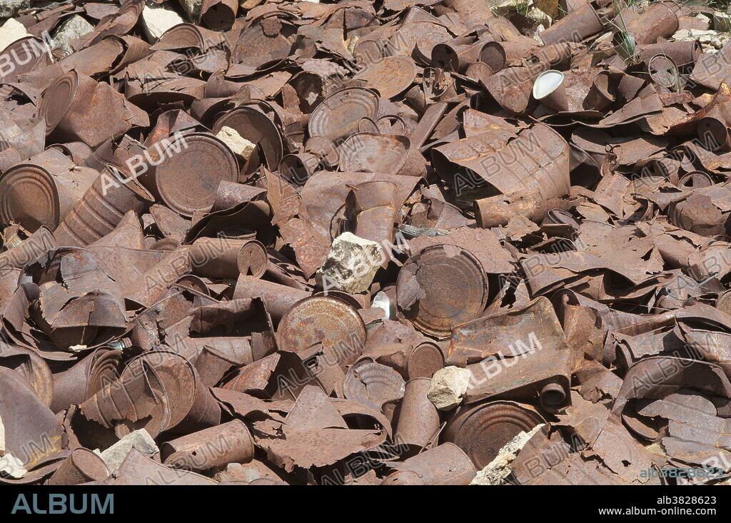 Old mining tin can dump on Mt. Aspen, Colorado. During the silver boom days of the 1890s, AspenÂ’s population grew to 12,000. After the silver bust in the early 1900s, as few as 700 people remained during what is known as the Â“quiet yearsÂ”, until it was reborn as a ski town in the 1940s. Many remnants of the mining era can be seen on the slopes of the mountains surrounding Aspen.