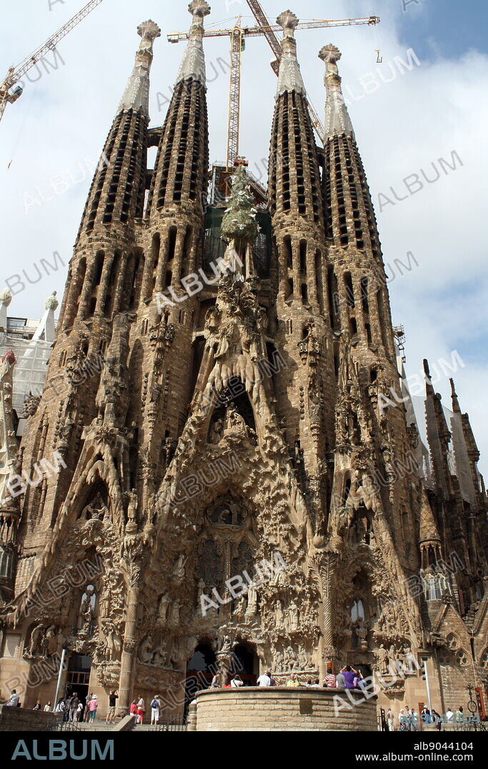 The Basilica I Temple Expiatori de la Sagrada Familia (Sagrada Familia). The very large Roman Catholic church was designed by Catalan architect Antoni Gaudi in a Spanish gothic style architecture as well as incorporating modernism, noucentisme and art nouveau. Although construction began in 1882 it was finally opened November 2010. Barcelona. Spain 2013.