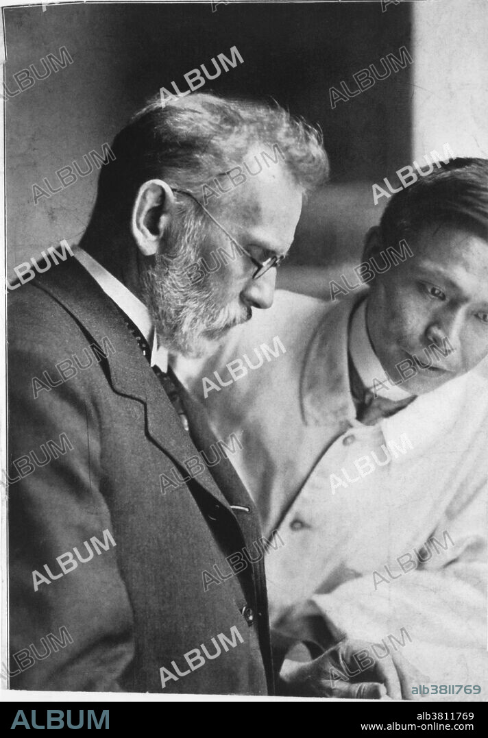 Ehrlich and Hata. Portrait of Paul Ehrlich (1854-1915) and Sahachiro Hata (1873-1938), the bacteriologists from Germany and Japan respectively who discovered the first cure for syphilis. From 1896 Ehrlich (left) tried to find a chemical that combatted the Trypanosoma parasites that caused sleeping sickness. By 1907 he tried his 606th compound, dihydoxydiamino-arsenobenzene, but found it ineffective. In 1909 Hata, a new student of Ehrlich's, was practizing in the use of arsenic compounds when he found that compound 606 was effective against the syphilis bacillus Treponema pallidium. Ehrlich, who had tried over 900 chemicals, named compound 606 salvarsan (now called arsphenamine).