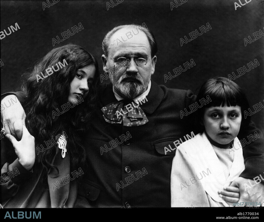 Emile Zola with two children. The French journalist, essayist and novelist Emile Zola hugging two girls. 1890s.