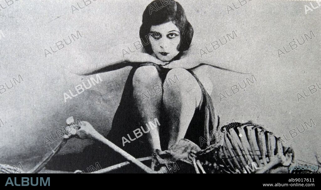 Theda Bara (1885-1955) and the skeleton of one of her victims from the 1915 film A Fool There Was.