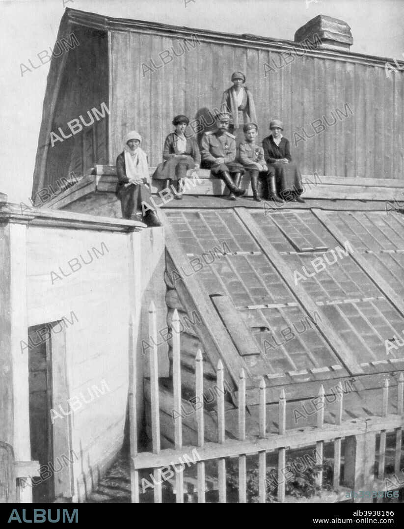 Tsar Nicholas II and his children sitting on a greenhouse, Tobolsk, Siberia, Russia, 1917. Compelled to abdicate in the wake of the February Revolution, Nicholas and the Royal family were exiled to Siberia. They were murdered by their Bolshevik guards at Yekaterinburg on 17 July 1918.