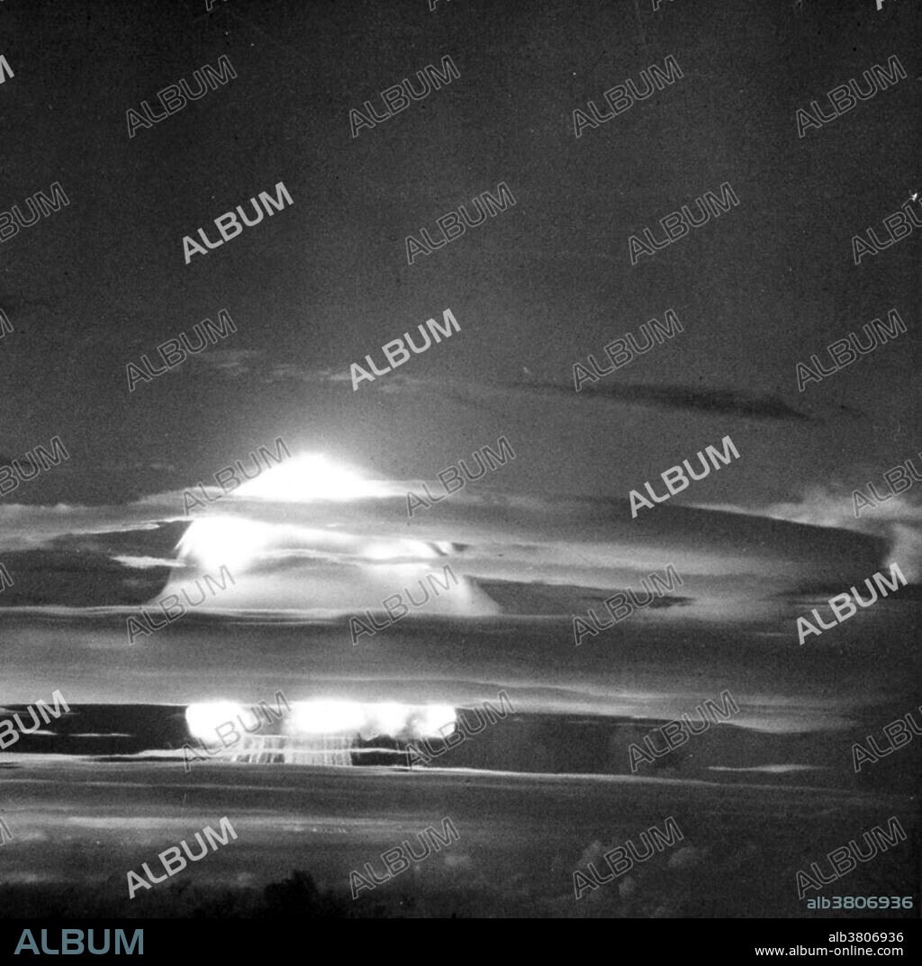 Mike, at a height of approximately 12,000 feet - 50 miles from the detonation site. Two minutes after Zero Hour, the cloud rose to 40,000 feet. Ten minutes later, the cloud stem had pushed upward about 25 miles, deep into the stratosphere. The mushroom portion vent up to 10 miles, and spread for 100 miles. Operation Ivy was the eighth series of American nuclear tests. Its purpose was to help upgrade the U.S. arsenal of nuclear weapons in response to the Soviet nuclear weapons program. The two explosions were staged in late 1952 at Eniwetok Atoll in the Pacific Proving Ground in the Marshall Islands. The first Ivy shot, Mike, was the first successful full-scale test of a multi-megaton thermonuclear weapon (hydrogen bomb) using the Teller-Ulam design. Unlike later thermonuclear weapons, Mike used deuterium as its fusion fuel, maintained as a liquid by an expensive and cumbersome cryogenic system. It was detonated on Elugelab Island on October 31, 1952, yielding 10.4 megatons, almost 500 times the yield of the bomb dropped on Nagasaki. Eight megatons of the yield was from fast fission of the uranium tamper, creating massive amounts of radioactive fallout. The detonation left an underwater crater 6,240 feet wide and 164 feet deep where Elugelab Island had been.