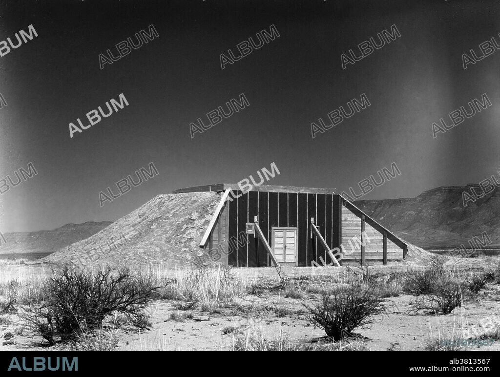 Trinity Test Site. The Manhattan Project was a research and development program by the US with the UK and Canada that produced the first atomic bomb during WWII. From 1942-46, the project was under the direction of Major General Leslie Groves of the US Army Corps of Engineers. Because of the complexity of an implosion-style weapon, it was decided that an initial test would be required. Groves approved the test, subject to the active material being recovered. Consideration was therefore given to a controlled fizzle, but Oppenheimer opted instead for a full-scale nuclear test, codenamed Trinity. Bainbridge selected the bombing range near Alamogordo Army Airfield as the site for the test. A base camp was built to house staff. A one-hundred foot shot tower was designed and constructed at ground zero. Concrete bunkers to house cameras and other diagnostic equipment popped up in a rough circle around ground zero. A commitment had been made to test the gadget "as soon after July 15th as possible," and before or during the upcoming Potsdam Conference. TNT Trinity Test occured on July 16th.