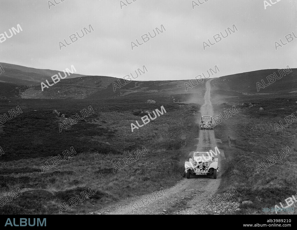 SS Jaguar 100 Open 2-seater. 1938/39  Reg. No.  DDV777.Entry No: 4. Driver: Watson, Miss. E. Violet . Background: Humber Saloon 1938 Vehicle Reg. No.  DVC883.  Entry No: 6. R.S.A.C. Scottish Rally. Date: 29.5-2.6.39.