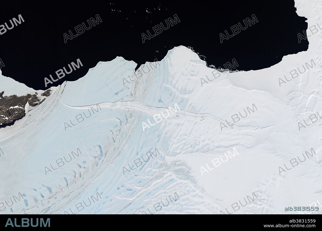 A floating shelf of ice attached to the coast of Antarctica is ready to shed an iceberg into the Southern Ocean. Over the course of two years, a small crack grew large enough to spread across nearly the entire width of the Nansen Ice Shelf. The crack is visible crossing the ice shelf horizontally in the center of this Landsat 8 satellite image captured on December 16, 2015.
