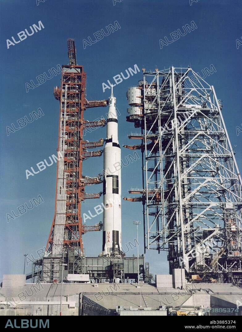 December 17, 1968 - Ground-level view of the Apollo 8 (Spacecraft 103/Saturn 503) space vehicle at Launch Complex 39, Kennedy Space Center, Cape Canaveral, Florida. The Apollo 8 stack was photographed during a prelaunch alert-mobile service structure pull back. (Mobile launch tower on left and mobile service structure on right.).
