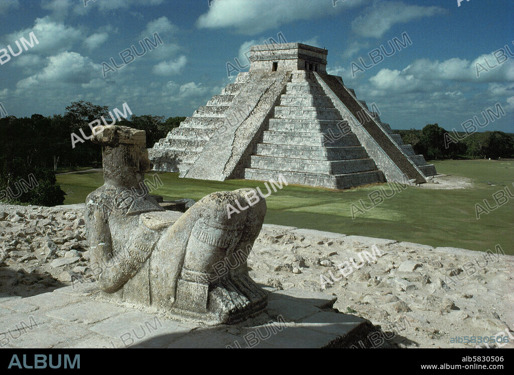 The figure of a Chac-Mool, ready to receive the hearts of victims of human sacrifice, gazes at Kukulcan Pyramid at Chichen Itza, Yucatan. The Site was founded by the Maya, but building continued by invading Toltecs after 918. Height of the Pyramid 30 m. 11th.