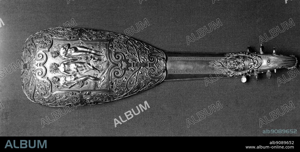 Pandurina ; Paris ( a small lute like instrument strung with wire ) circa 1570 , pearwood 16 1/2 x 4 1/2 inches or 41.9 x 11.4 cm. The Victoria and Albert Museum , London.