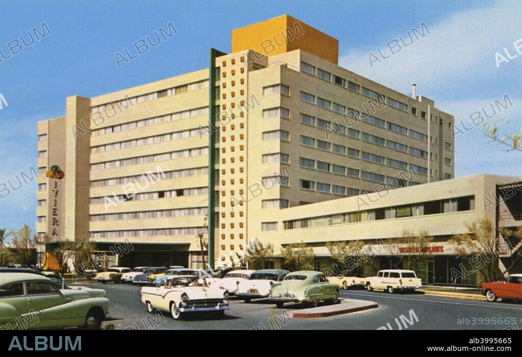 Riviera Hotel and Casino, Las Vegas, Nevada, USA, 1956. Vintage postcard showing the exterior of the new shyscraper hotel, the Riviera. Cars fill the parking lot. The Riviera opened in 1955. It was the ninth resort to be built on The Strip and the first to incorporate a high-rise building.