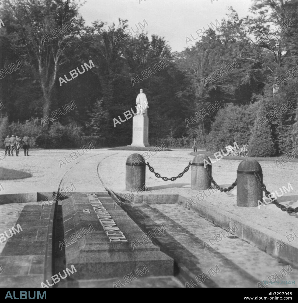 Hitler at site of the signing of the Armistice on the 11th of Nov. 1918. In the background is the statue of Marshal Foch in the Forest of Compiegne.