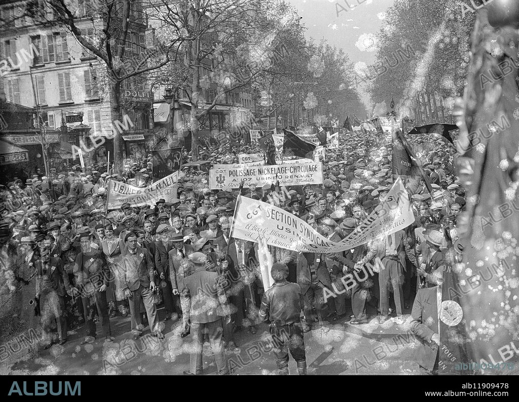 May Day celebrated in Paris with great parade. May Day was celebrated in Paris with a great Popular Front procession through the streets in which many thousands took to parrt. Shops and businesses were closed and a festive atmosphere prevailed, though forces of Mobile Guards stood by in case of trouble. Photo shows, a general view of the procession in the Palace Bastille. 1 May 1937.
