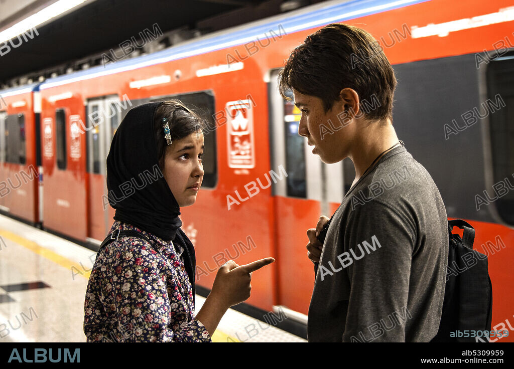ROOHOLLAH ZAMANI and SHAMILA SHIRZAD in SUN CHILDREN, 2020 (KHORSHID), directed by MAJID MAJIDI. Copyright Majid Majidi Film Production.