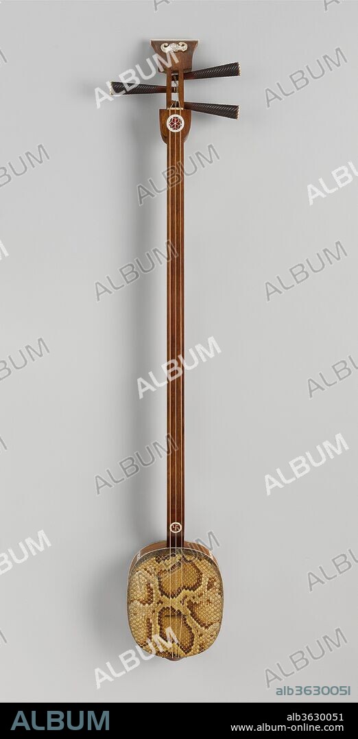 Sanxian (?? ). Culture: Chinese. Dimensions: 48 7/16 × 6 7/8 × 3 9/16 in. (123 × 17.5 × 9 cm). Date: 19th century.
There are two forms of the sanxian: a large one from the North, with a thin metal plate attached inside to enrich the sound, and a smaller version from the South. Like the pipa, the sanxian may accompany narrative song, changing its tuning to accommodate the singer. The bat decorating the finials of this instrument is a symbol of good fortune and appears on many Chinese objects.