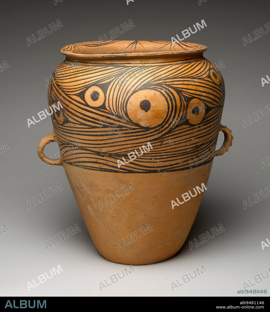 Storage Vessel, c. 3000 BCE, 14 3/16 x 12 13/16 x 11 13/16 in. (36.04 x 32.54 x 30 cm), Earthenware with painted designs and burnished surface, China, 31st-30th century BCE, The high shoulder, flat bottom, and wide mouth of this handsome vessel would have made it an effective storage jar. The well-proportioned hand built vessel has been decorated with a strikingly linear design of clustered swirls interrupted by large, round 'eyes' on a burnished ground. The Majiayao type (3,100-2,700 BCE) is characterized by the severe linearity of its painted designs usually executed in black only, and the meanings of this décor has yet to be determined. This dynamic pattern covers the upper half of the vessel ending just above the edge of the loop handles, one of which bears an applied strip or rippled clay along its spine. The other handle is plain. An urn of similar form and design was excavated in 1977 from Ciqi county in Gansu province.