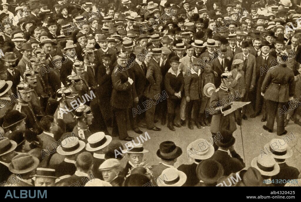 The Kaiser's proclamation of war against Britain is read out by military authorities, Berlin, Germany, 4 August 1914, (1933). Wilhelm II of Germany declared war against Britain, Britain responded by declaring war on Germany, and the First World War began. From "The Pageant of the Century". [Odhams Press Ltd, 1933].