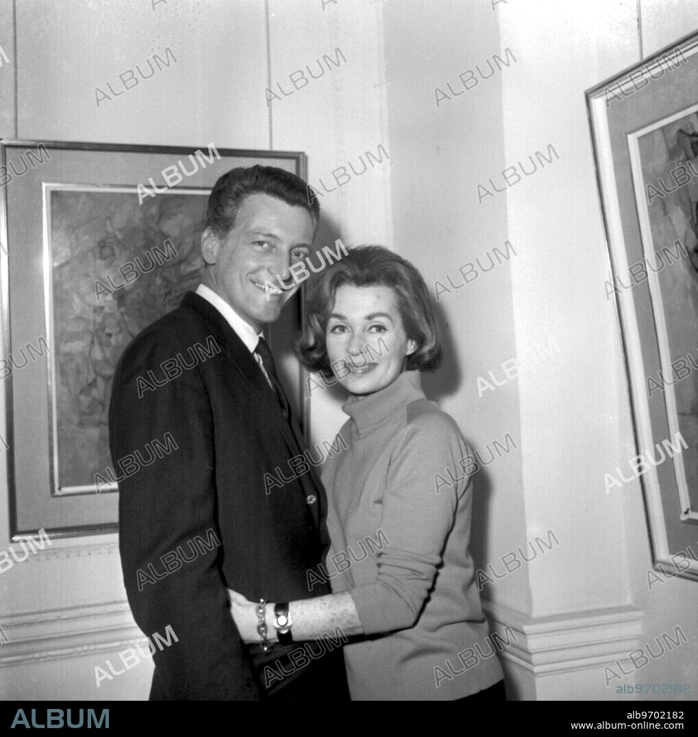 Lilli Palmer with her husband Argentine actor Carlos Thompson, at Lilli's exhibition of her paintings at the Galleries of Arthur Tooth and Sons in London. 6th December 1965.