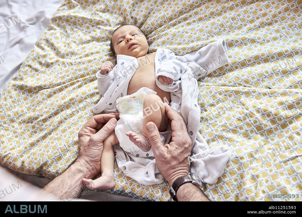 Reportage on a midwife in Lyon, France. A 7-day old baby.