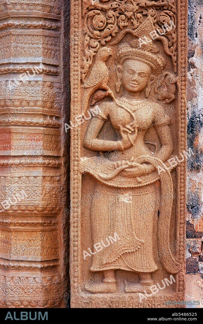 Prasat Sikhoraphum is a Khmer Hindu temple built in the 12th century by King Suryavarman II (r. 1113 - 1150). Prasat Sikhoraphum dates from the early 12th century and has been beautifully restored. It consists of five brick prangs on a square laterite platform surrounded by lily-filled ponds. The lintel and pillars of the central prang are beautifully carved with heavenly dancing girls, or apsara, and other scenes from Hindu mythology. An Apsara (Sanskrit: apsara?; Khmer: tep apsar; Pali: acchara; Vietnamese: A B? Sa La Tu, Malay / Indonesian: bidadari; Javanese: widodari; Thai: apson), is a female spirit of the clouds and waters in Hindu and Buddhist mythology. English translations of the word 'apsara' include 'nymph', 'celestial nymph', and 'celestial maiden'.