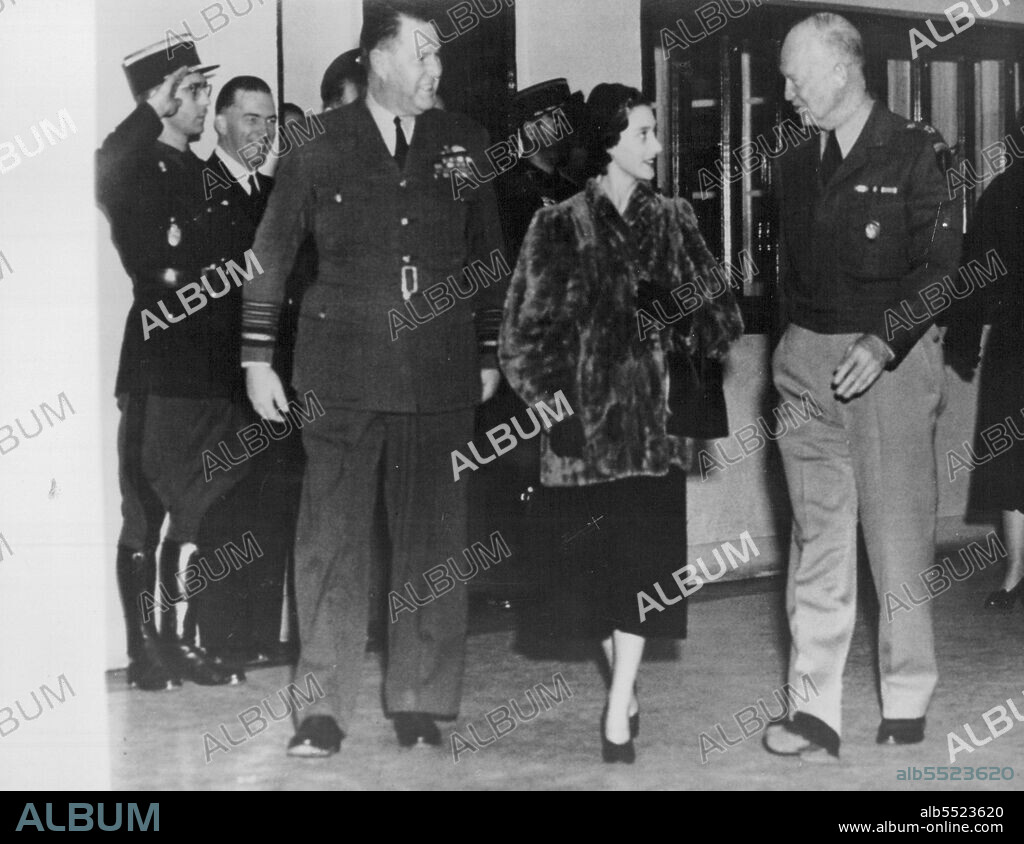Princess Margaret At Shape - Princess Margaret is escorted by Air Chief Marshal Sir Hugh Saunders (left) and by General Dwight D. Eisenhower as she leaves S.H.A.P.E. after having tea with the general there today November 23. November 23, 1951. (Photo by Associated Press Photo).