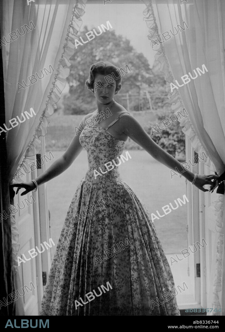 H.R.H Princess Alexandra - This new study of her Royal Highness Princess Alexandra of Kent was made by Mr. Cecil Beaton in the drawing room at Kensington Palace, London, July 29, 1955. In the Picture, H.R.H. is wearing pearl Ear-rings, diamond and pearl Necklace and pearl bracelets with a red and white flowered evening gown. August 24, 1955. (Photo by Associated Press Photo).