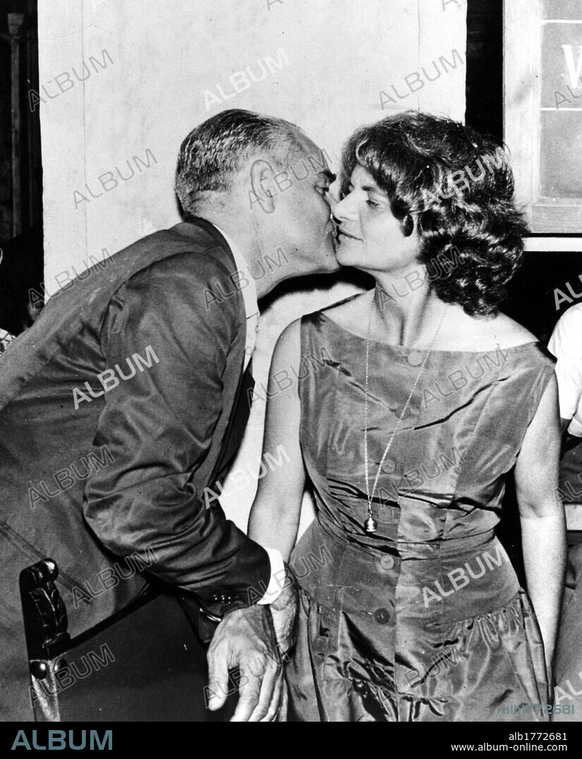 Alberto Moravia kisses Elsa Morante. The Italian writer Alberto Moravia kissing his wife Elsa Morante. The Italian writer has just won the Strega Prize with her novel. 1957.