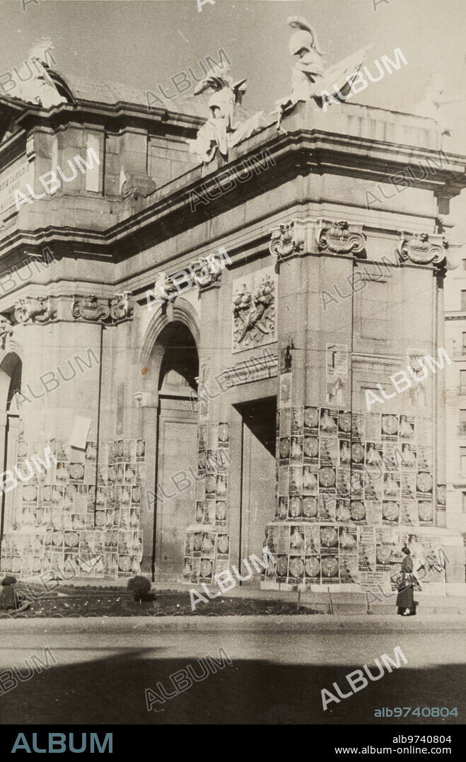 Madrid, 02/12/1936. The door of Alcalá covered with electoral propaganda posters.