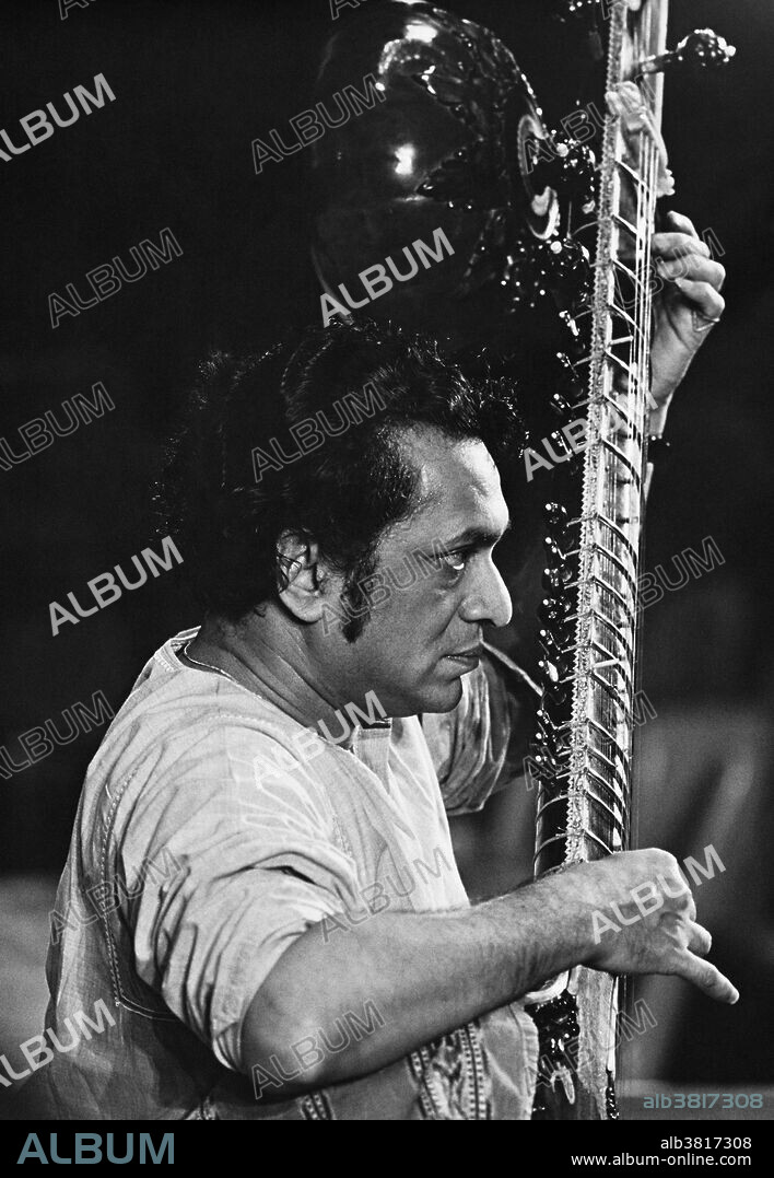 Undated image of the iconic sitar player Ravi Shankar. Ravi Shankar playing a classical Indian raga on sitar. Ravi Shankar (born April 7th, 1920) is an Indian musician and composer who plays the plucked string instrument sitar. He has been described as the most known contemporary Indian musician. Shankar is considered one of the top sitar players of the second half of the 20th century. He became known for a distinctive playing style in the middle and high registers that uses quick and short deviations of the playing string and his sound creation through stops and strikes on the main playing string.
