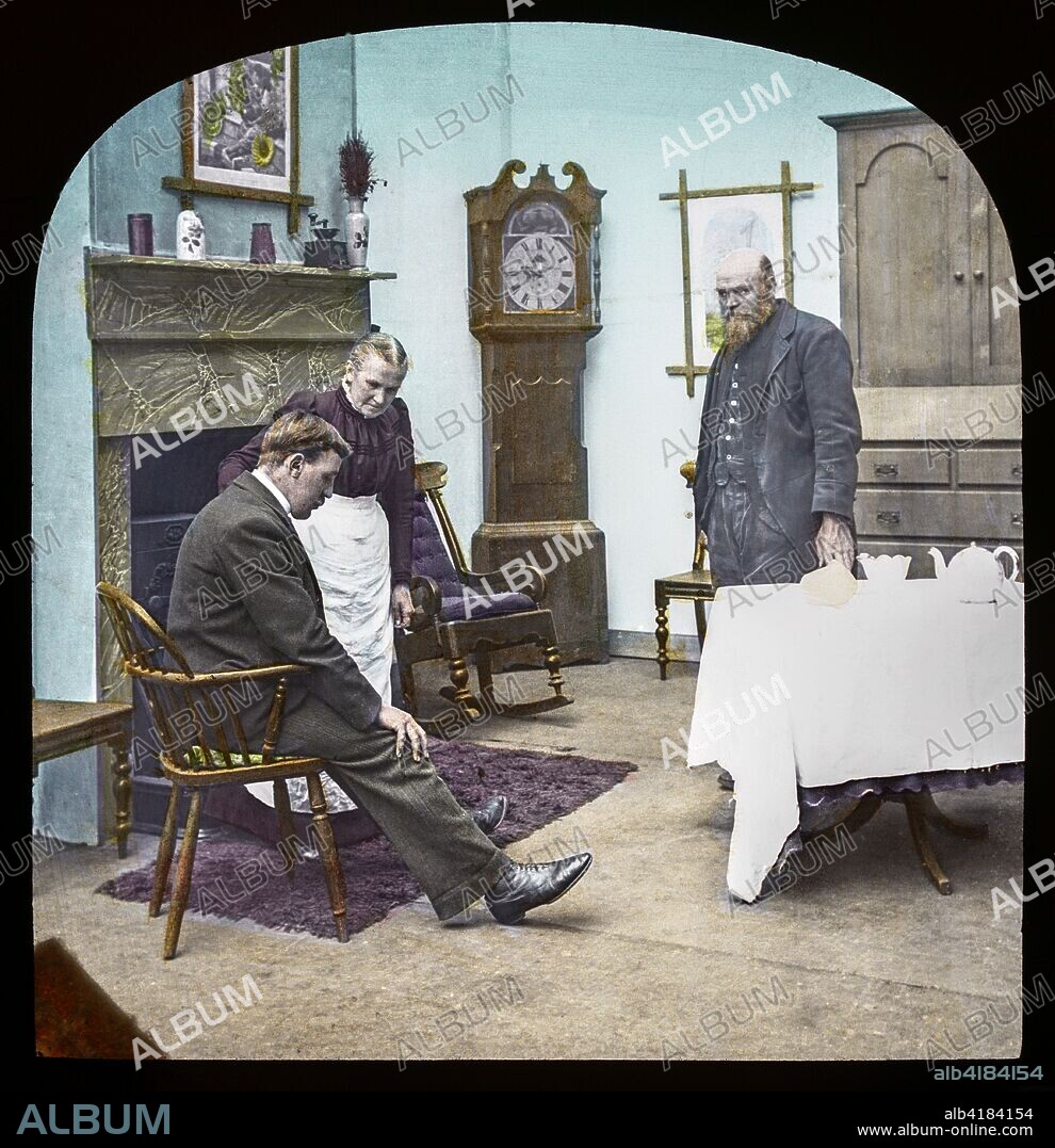 Magic lantern slide circa 1900.Victorian/Edwardian.Social History. Fighting for the Queen, a service of song, M.S. Haycraft (arr. James Broadbent and James W. Broadbent), Fighting for the Queen (Leeds: James Broadbent, n.d.).  Slide 12 Tom dared not tell his father the two pounds had been won by gambling. Mother,Father and son in drawing room unhappy.
