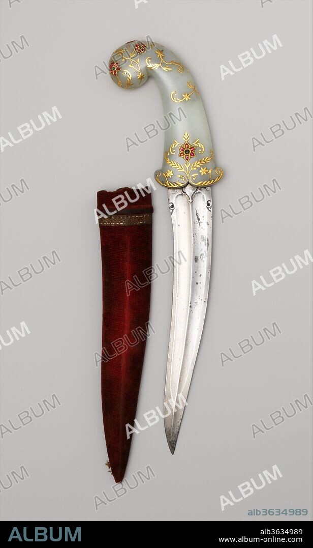 Dagger (Khanjar) with Sheath. Culture: Indian, possibly Lucknow. Dimensions: H. with sheath 14 1/2 in. (36.8 cm); H. without sheath 13 5/8 in. (34.6 cm); W. 3 5/8 in. (9.2 cm); Wt. 12.3 oz. (348.7 g); Wt. of sheath 0.9 oz. (25.5 g). Date: late 18th century.
The hilt of this dagger has been attributed to the court workshops patronized by the nawab of Oudh at Lucknow, in northern India, in about 1785. Its form and decoration, however, were traditional in many courts in Mughal and Deccani states in the eighteenth century. The pale green nephrite jade hilt inlaid with rubies and emeralds is noteworthy for its delicacy and restraint.