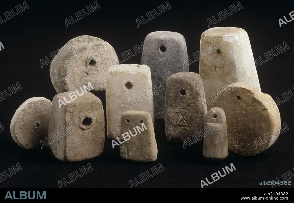 PESAS DE TELAR. ROMANO AJUAR. (DEPOSITO: MUSEO ARQUEOLOGICO NACIONAL).