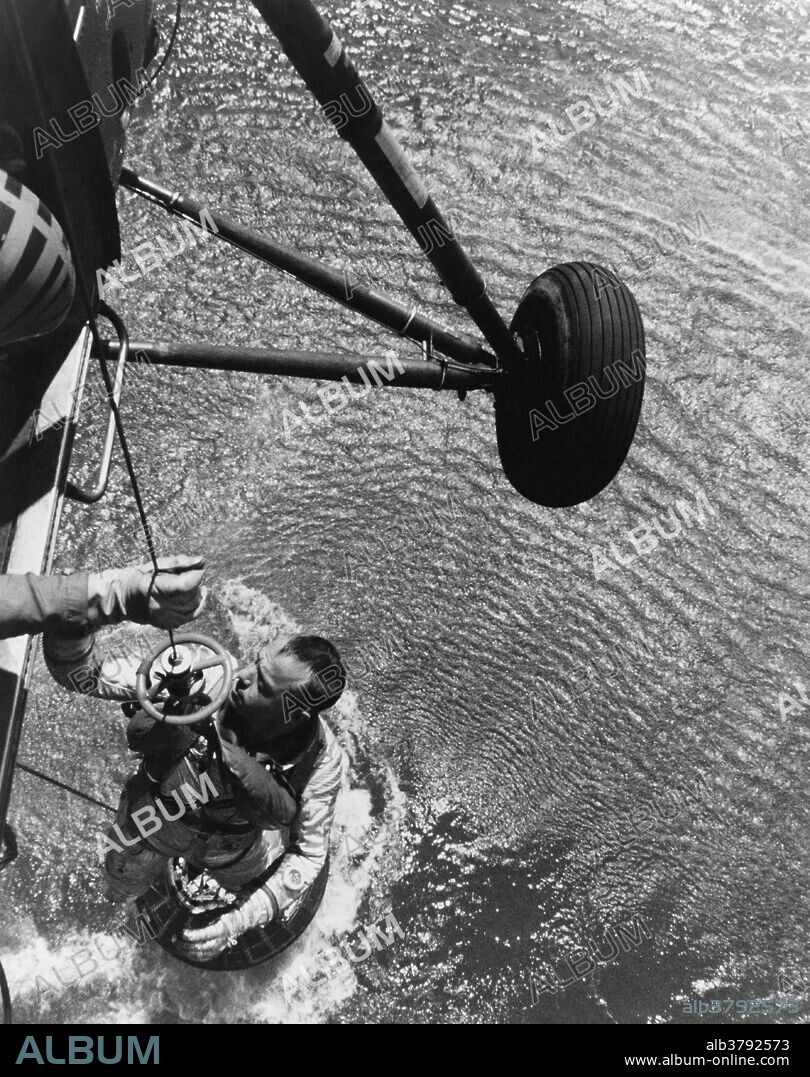 Astronaut Alan B. Shepard, Jr. is recovered by a US Marine helicopter after a successful suborbital flight, the first in the Project Mercury program; May 5, 1961.