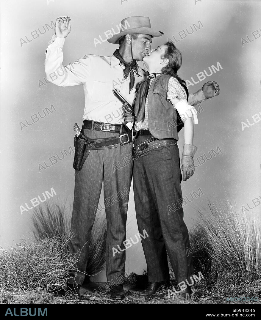 ANNE JEFFREYS and RANDOLPH SCOTT in RETURN OF THE BAD MEN, 1948, directed by RAY ENRIGHT. Copyright RKO.