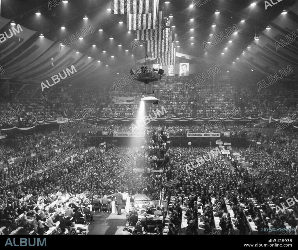 Overall view of the Republican Party's National Convention at the International Amphitheatre in Chicago, Ill in 1960. Hanging in the background are photographs of President Eisenhower, President Abraham Lincoln and Vice-President Richard Nixon.