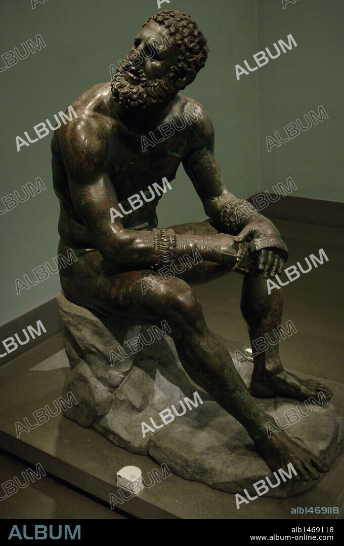 Greek Art. Hellenistic. Boxer of Quirinal or the Terme Boxer. Bronze sculpture of the Hellenistic period (1st century B.C.). Boxer sitting at rest, with metal and leather dressings used for combat. Palazzo Massimo. National Roman Museum. Rome. italy.