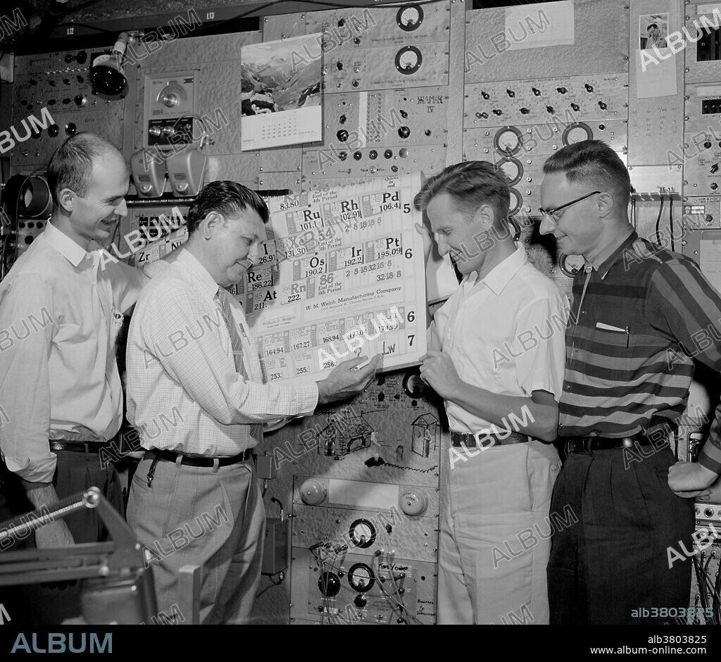 Updating the periodic table. Ghiorso inscribes "Lw" in space 103; co-discoverers (left to right) Robert Latimer, Torbjorn Sikkeland, and Almon Larsh look on, April 1961. The first important work on element 103 was carried out at Berkeley by the nuclear-physics team of Albert Ghiorso, Torbjorn Sikkeland, Almon Larsh, Robert M. Latimer, and their co-workers on February 14, 1961. The first atoms of lawrencium were reportedly produced by bombarding a three-milligram target consisting of three isotopes of the element californium with boron-10 and boron-11 nuclei from the Heavy Ion Linear Accelerator (HILAC).