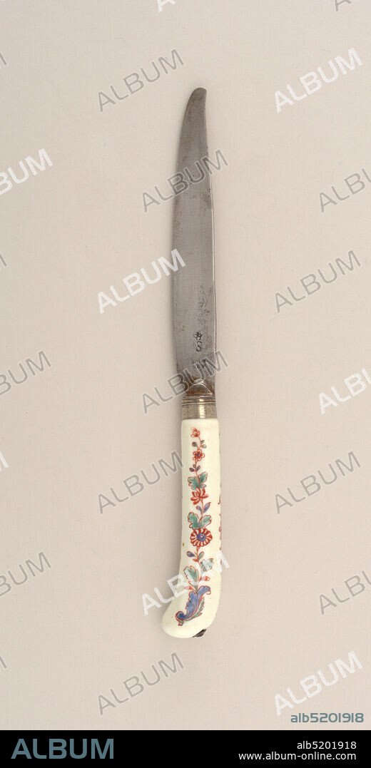 Knife with Floral Porcelain Handle, Chantilly Porcelain Manufactory, French, active ca. 1725 - ca. 1789, porcelain, vitreous enamel, silver, steel, Saber-shaped blade with drop bolster. Plain silver ferrule with horizontal bands. Pistol-shaped white porcelain handle. Octagonal in section. Floral design in green, blue and brown-red. Silver button at the top of the handle., France, 17301755, cutlery, Decorative Arts, knife, knife.