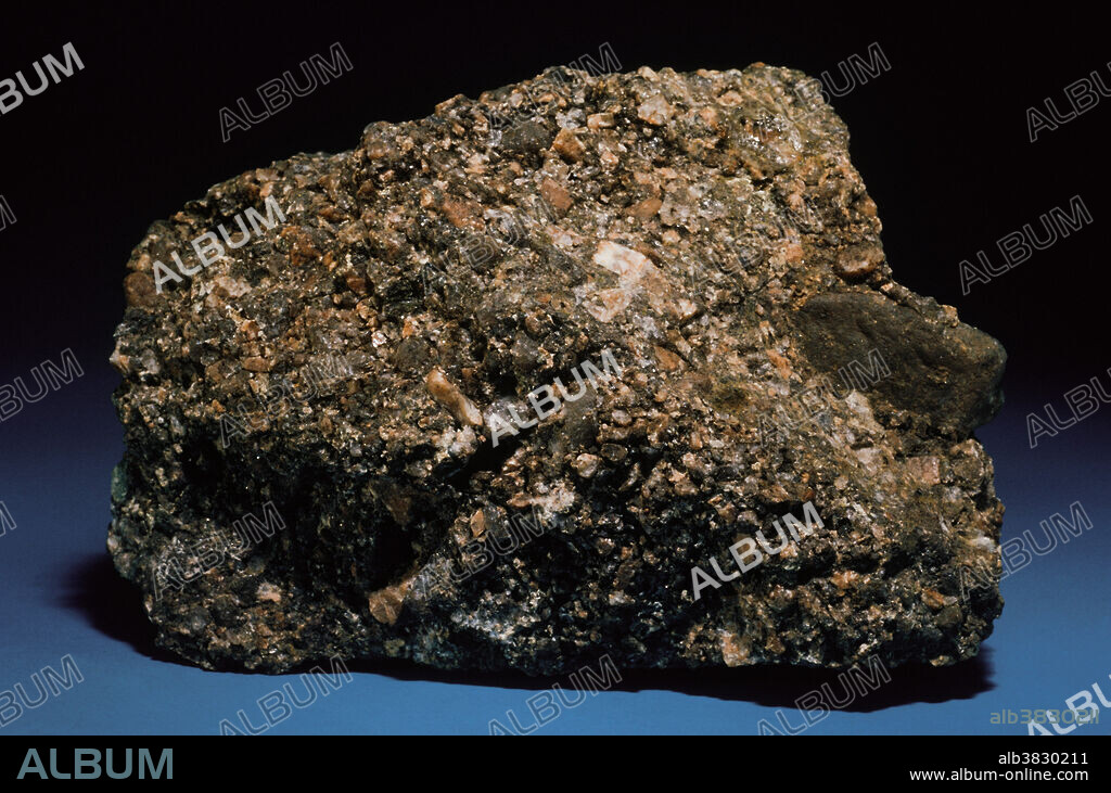 Arkose is a coarse-grained sedimentary rock that is rich in quartz and feldspar. It is unusual in that feldspar weathers rapidly at the earth's surface, and therefore seldom survives long enough to accumulate without alteration or disintegration. Arkose forms as a result of very rapid weathering of granite or gneiss, and rapid accumulation and compaction in situ of the weathering products, before they can alter or decompose. This rock from Mt. Tom, Massachusetts, consists of angular and sub angular grains of quartz and feldspar in a dense matrix of iron-rich clay.